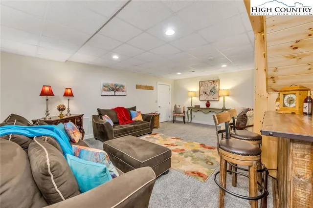 a bedroom with a bed and a book shelf