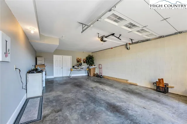 a view of a hallway with storage and utility room