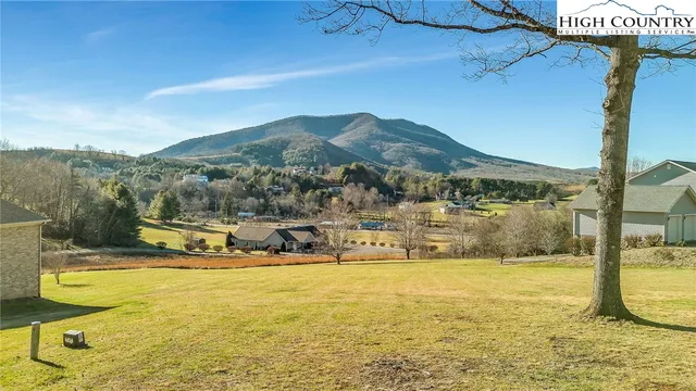 a view of an ocean with a mountain