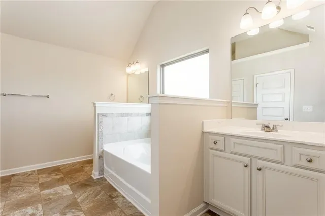 a bedroom with furniture and a chandelier