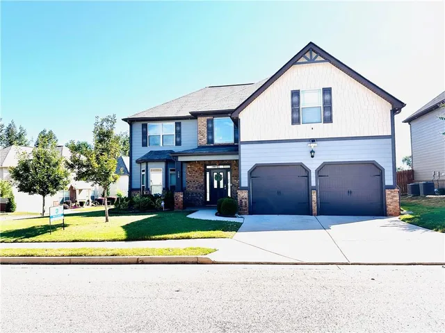a view of a big house with a outdoor space