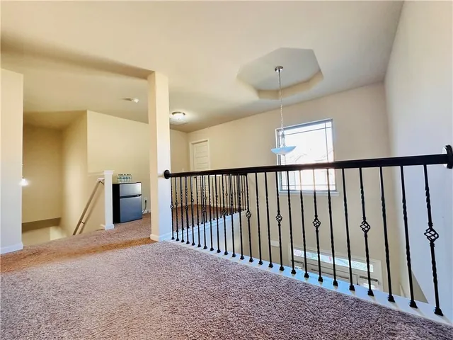 a view of a hallway with a window