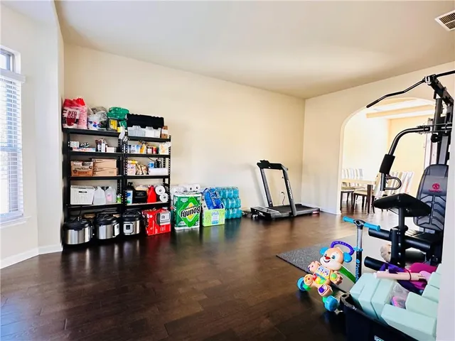 a living room with lots of furniture and toys