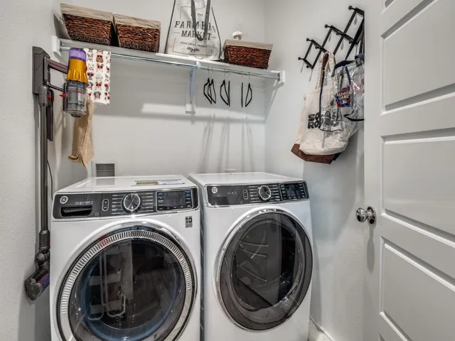 a kitchen with stainless steel appliances granite countertop a kitchen island a stove and a refrigerator
