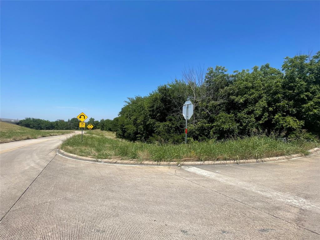3300 West Morton Street Denison, TX 75020 - Photo 4 of 6 a view of a road with a houses in the background