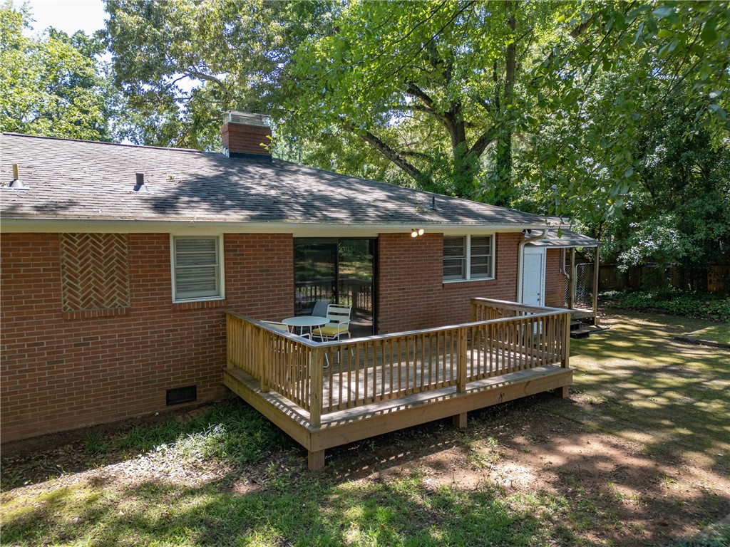 207 Brook Street Clemson, SC 29631 - Photo 37 of 39 A welcoming rear deck offers an ideal spot for outdoor enjoyment, overlooking a verdant backyard.