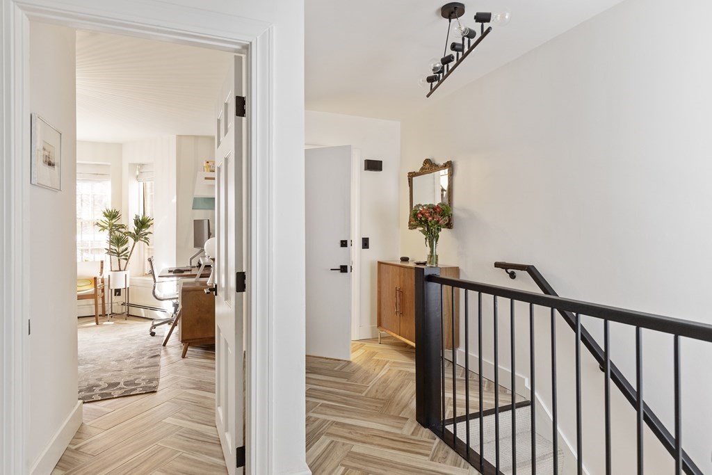 71 Dartmouth Street, Unit 1 Boston, MA 02116 - Photo 14 of 26 a view of a hallway to a livingroom and a dining room with wooden floor