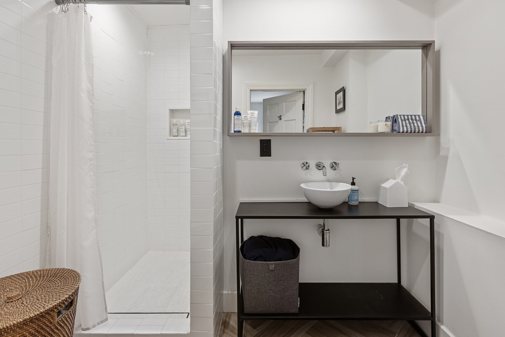 71 Dartmouth Street, Unit 1 Boston, MA 02116 - Photo 16 of 26 a bathroom with a sink and a mirror