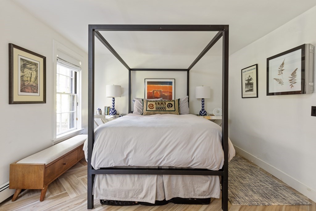 71 Dartmouth Street, Unit 1 Boston, MA 02116 - Photo 18 of 26 a bedroom with a bed and window