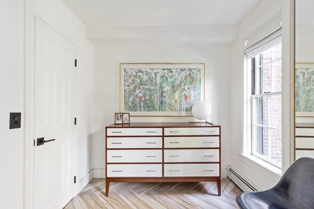 71 Dartmouth Street, Unit 1 Boston, MA 02116 - Photo 19 of 26 a view of a bedroom with furniture and windows