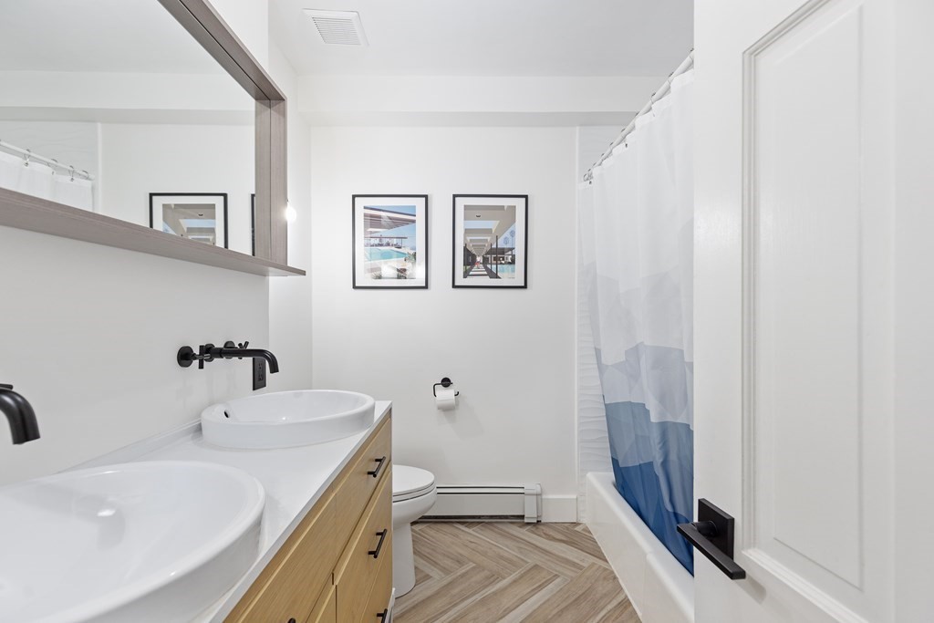 71 Dartmouth Street, Unit 1 Boston, MA 02116 - Photo 20 of 26 a bathroom with a sink a toilet and shower