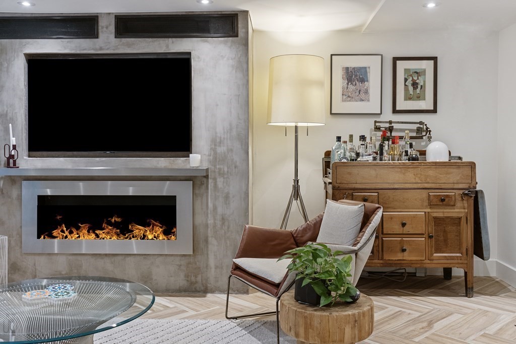 71 Dartmouth Street, Unit 1 Boston, MA 02116 - Photo 2 of 26 a living room with furniture and a fireplace