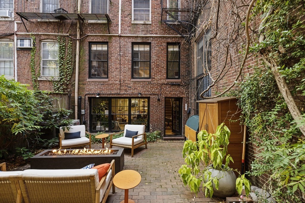 71 Dartmouth Street, Unit 1 Boston, MA 02116 - Photo 23 of 26 a view of a chairs and table in the patio
