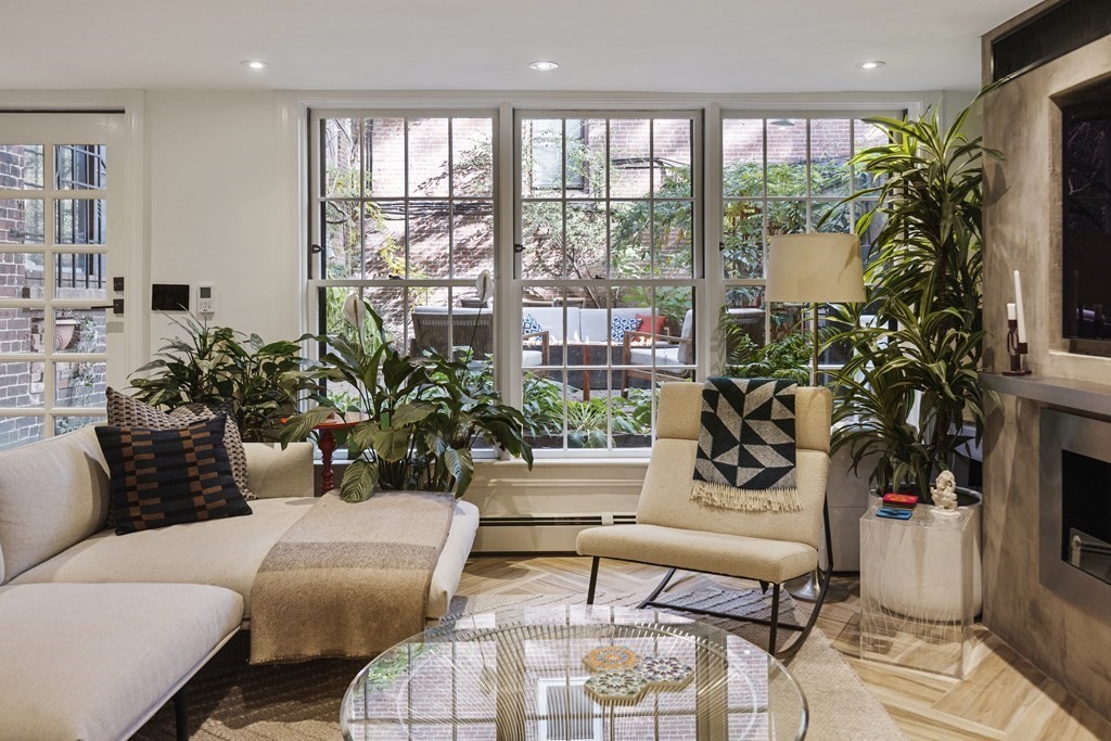 71 Dartmouth Street, Unit 1 Boston, MA 02116 - Photo 4 of 26 a living room with furniture and a potted plant