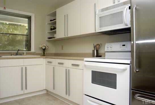 905 Marlborough Road Raleigh, NC 27610 - Photo 3 of 5 a kitchen with granite countertop white cabinets and white appliances