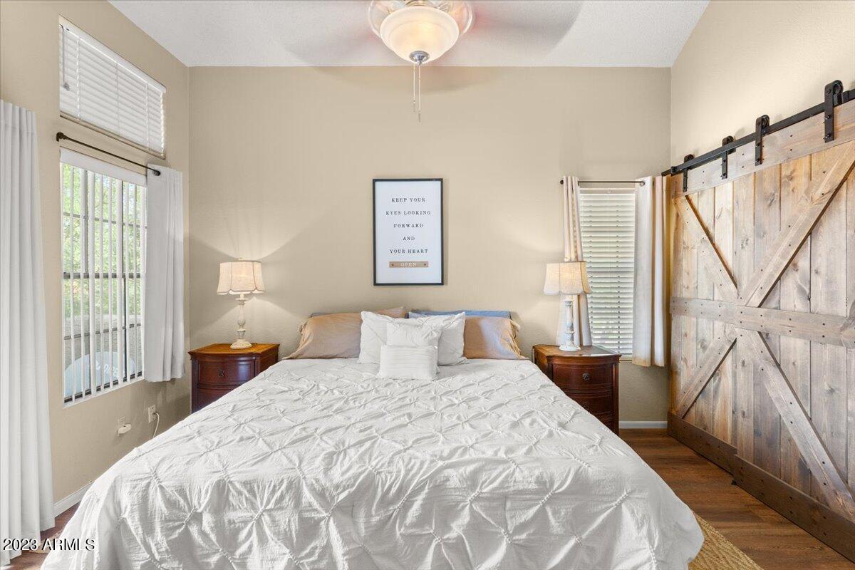 10017 East Mountain View Road, Unit 2053 Scottsdale, AZ 85258 - Photo 17 of 31 a bedroom with a bed and a large window