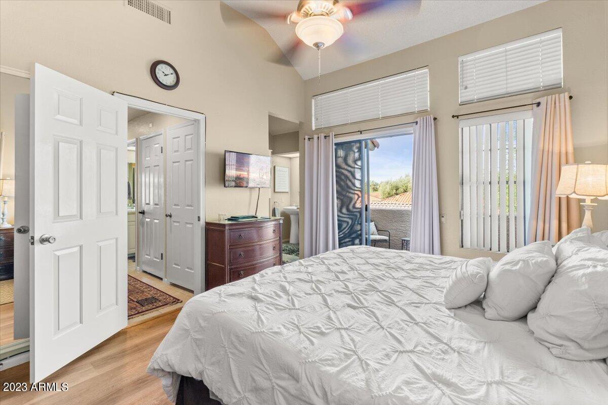 10017 East Mountain View Road, Unit 2053 Scottsdale, AZ 85258 - Photo 18 of 31 a bedroom with a bed and a dresser