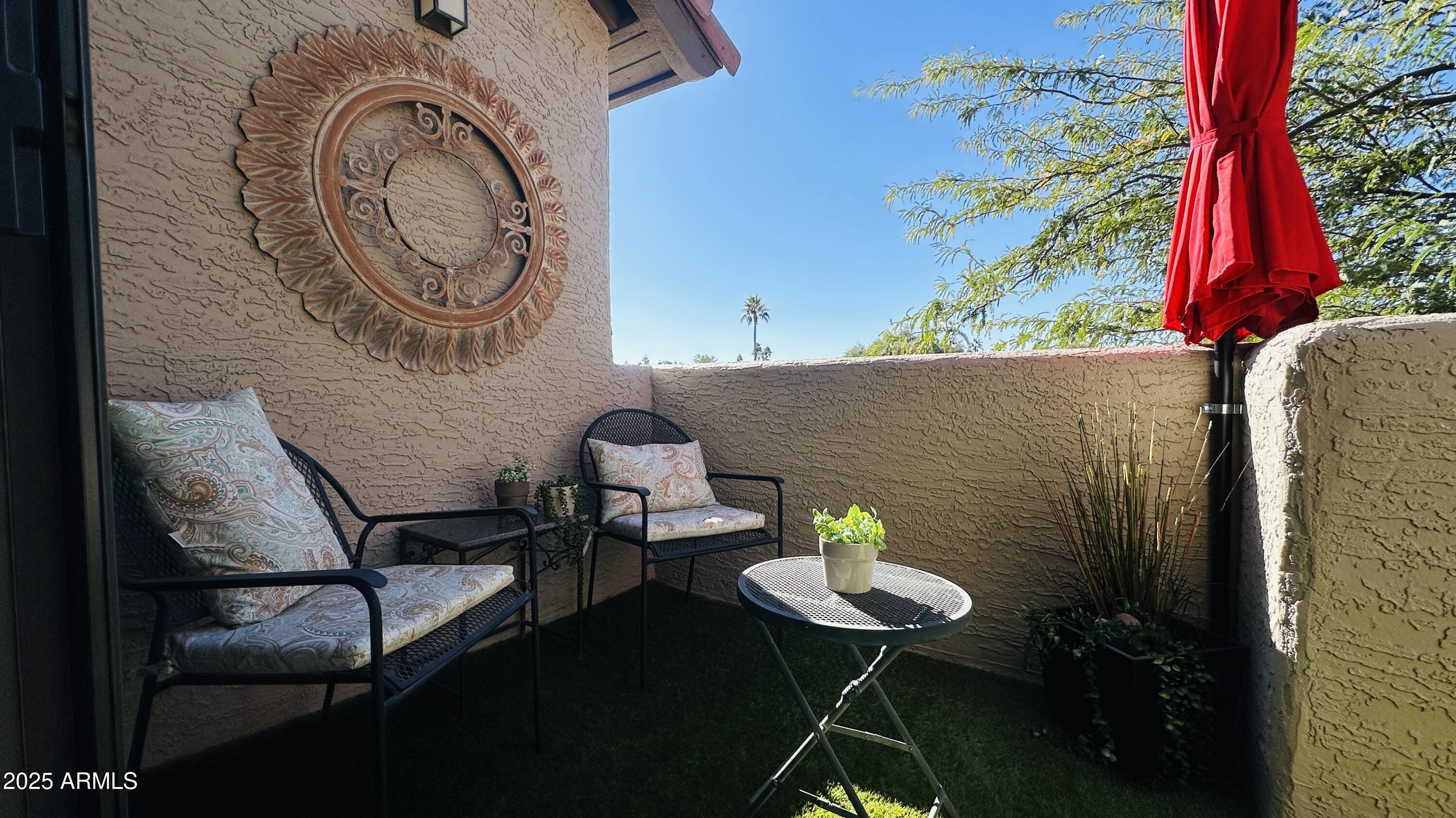 10017 East Mountain View Road, Unit 2053 Scottsdale, AZ 85258 - Photo 21 of 31 a backyard of a house with table and chairs