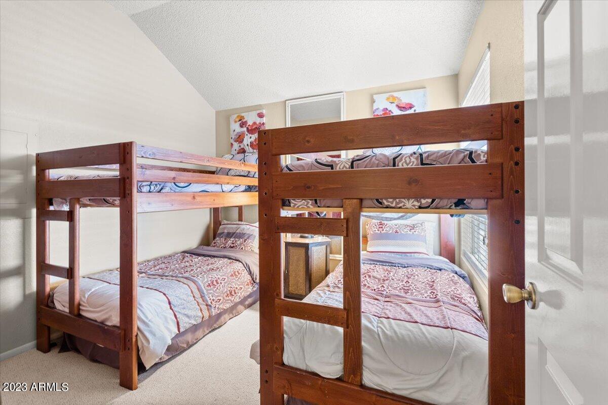 10017 East Mountain View Road, Unit 2053 Scottsdale, AZ 85258 - Photo 28 of 31 a bedroom with a bed and window