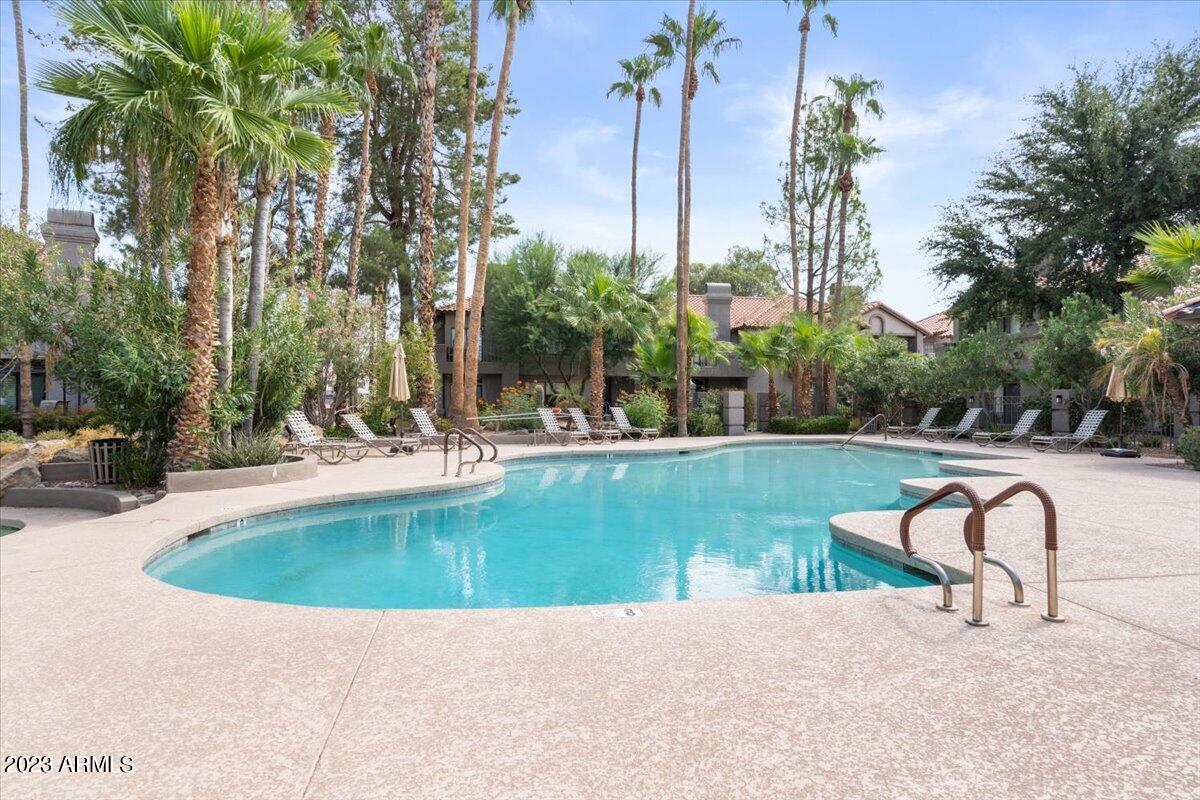 10017 East Mountain View Road, Unit 2053 Scottsdale, AZ 85258 - Photo 4 of 31 a view of a swimming pool with a patio