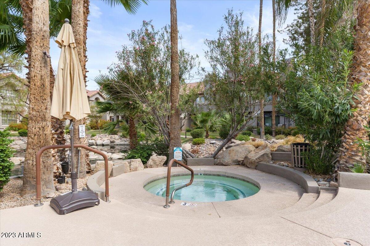 10017 East Mountain View Road, Unit 2053 Scottsdale, AZ 85258 - Photo 5 of 31 a view of roof deck with table and chairs and potted plants