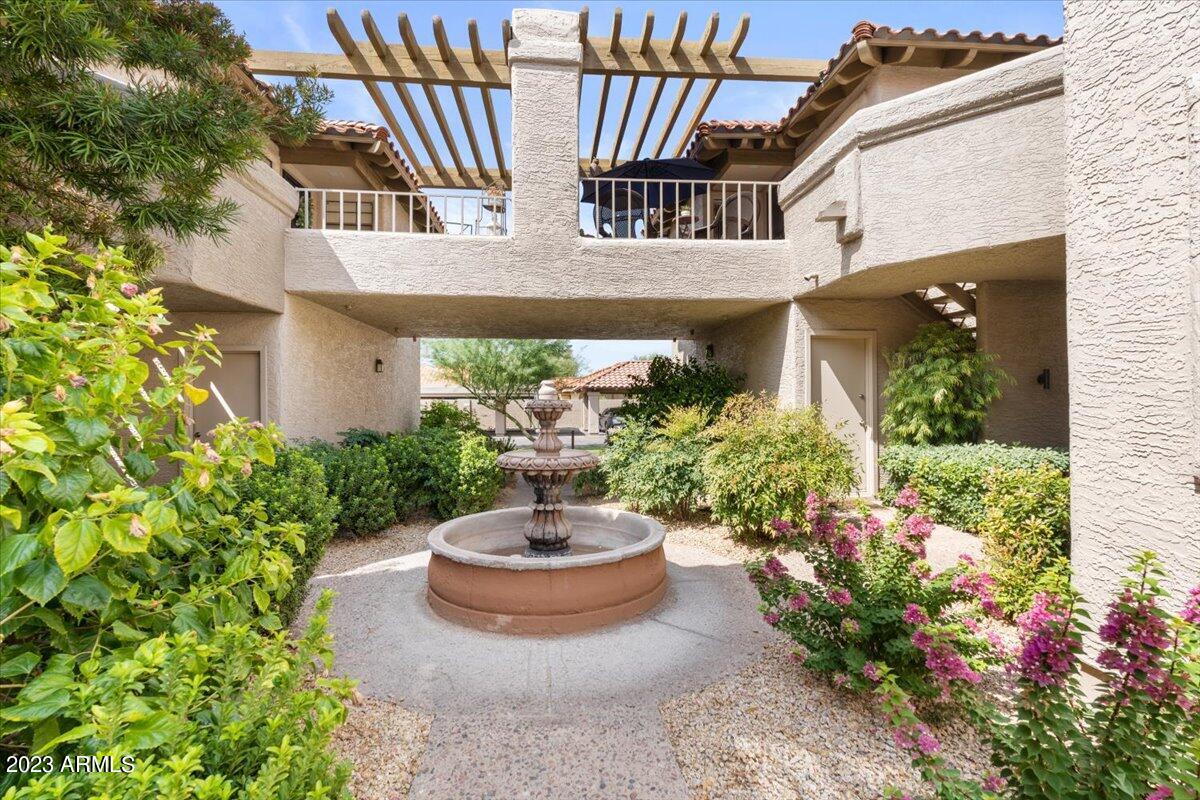 10017 East Mountain View Road, Unit 2053 Scottsdale, AZ 85258 - Photo 7 of 31 a view of a house with sitting area and garden view