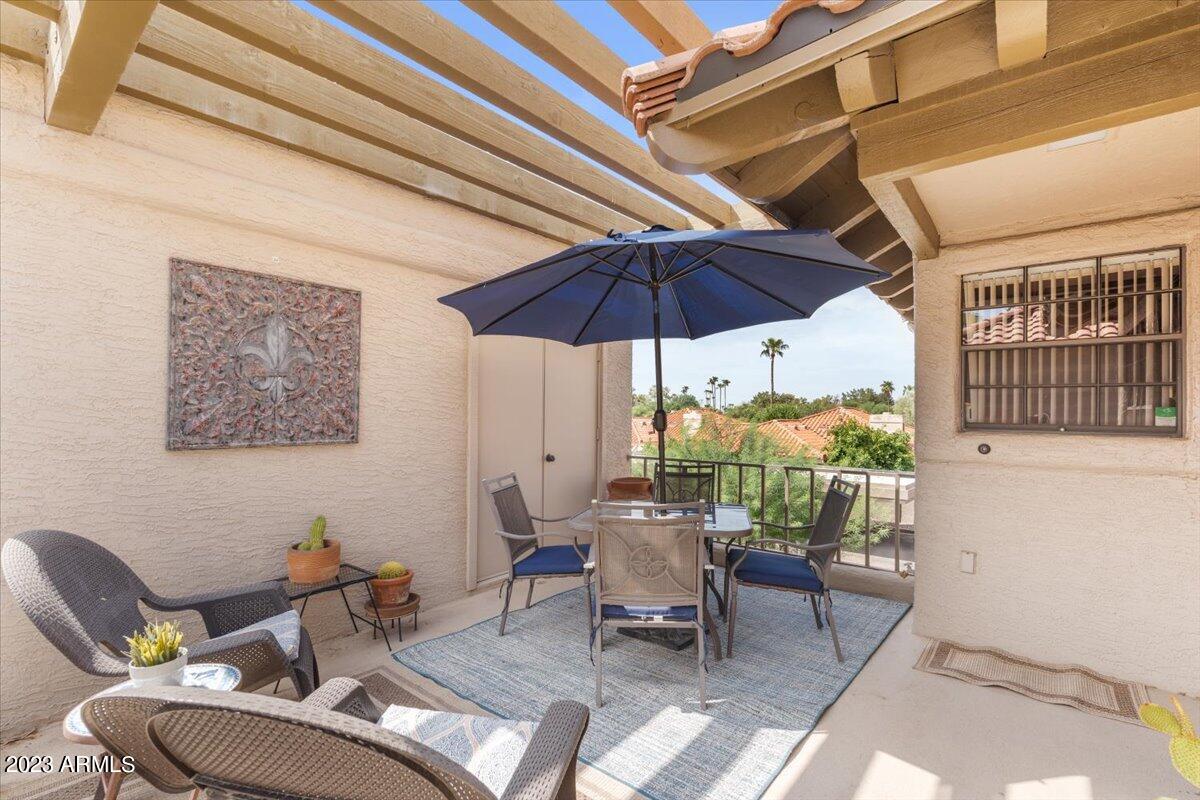 10017 East Mountain View Road, Unit 2053 Scottsdale, AZ 85258 - Photo 9 of 31 a view of a dining room with furniture and chandelier