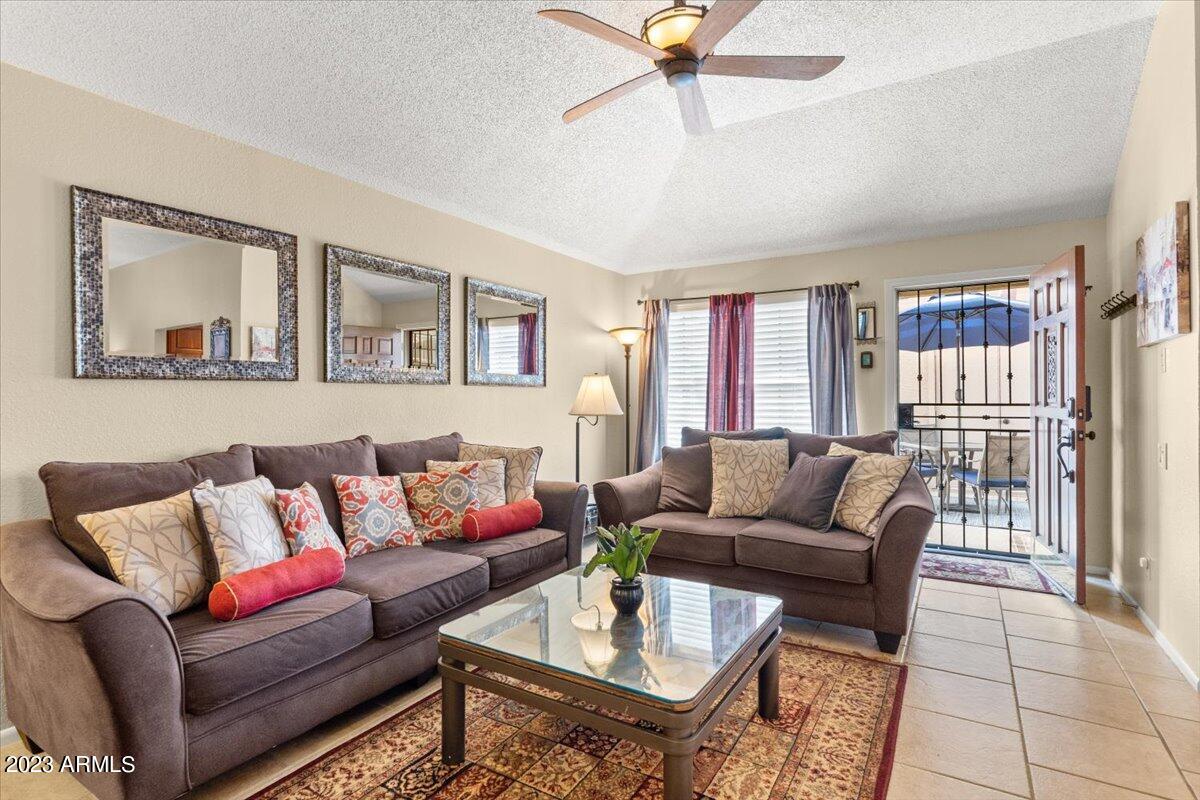 10017 East Mountain View Road, Unit 2053 Scottsdale, AZ 85258 - Photo 10 of 31 a living room with furniture and a large window