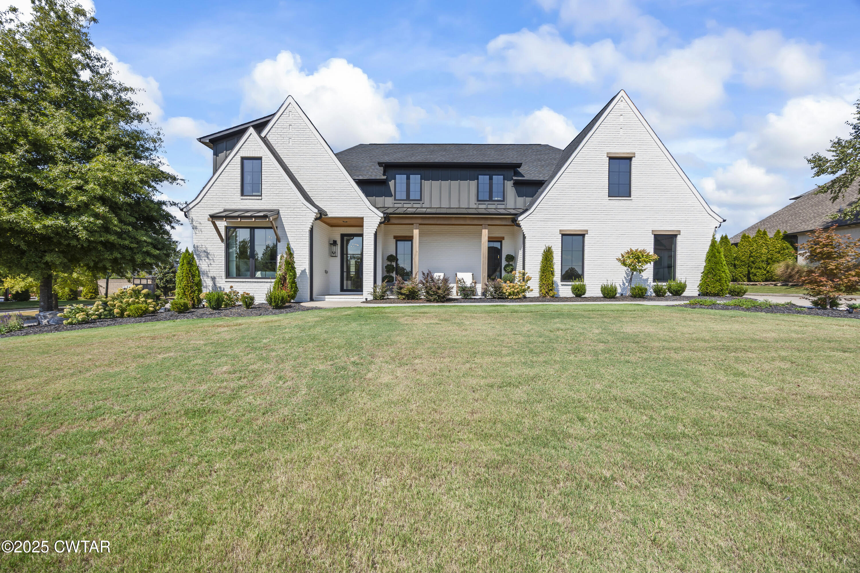 7 Swanbourne Cove Jackson, TN 38305 - Photo 1 of 44 a front view of a house with a yard