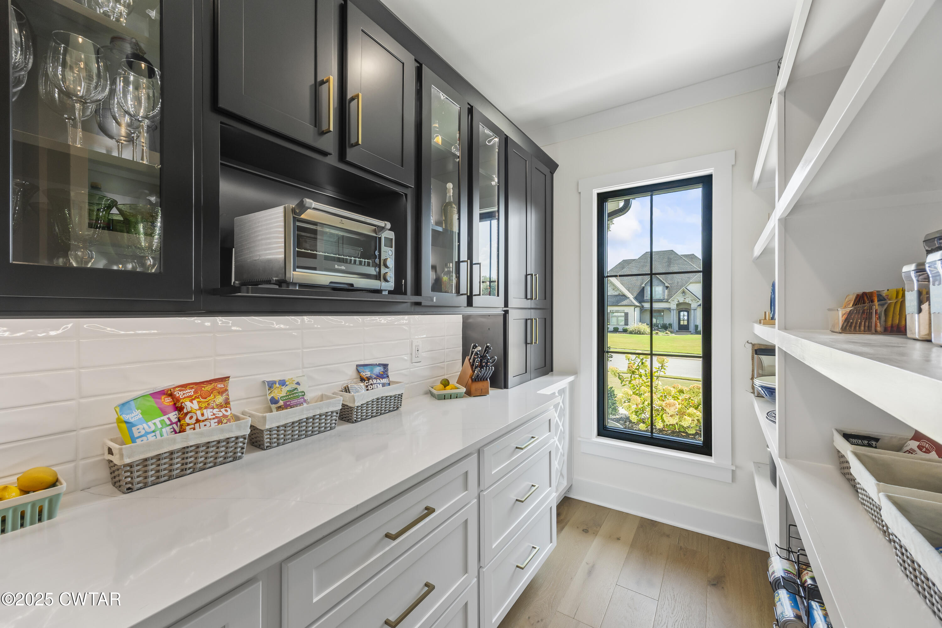 7 Swanbourne Cove Jackson, TN 38305 - Photo 13 of 44 a hallway with a window wooden floors and living room view
