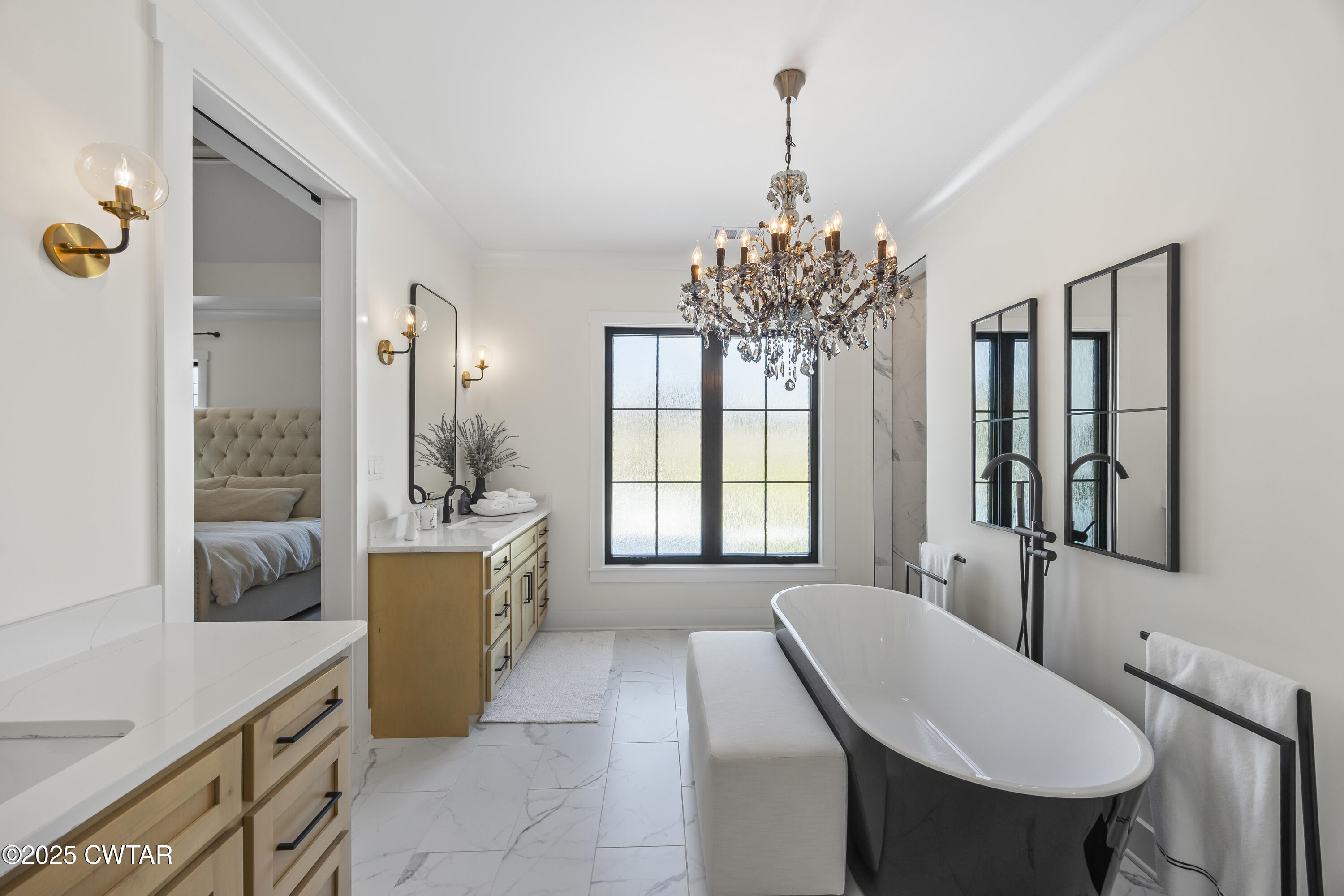 7 Swanbourne Cove Jackson, TN 38305 - Photo 17 of 44 a living room with furniture and a chandelier