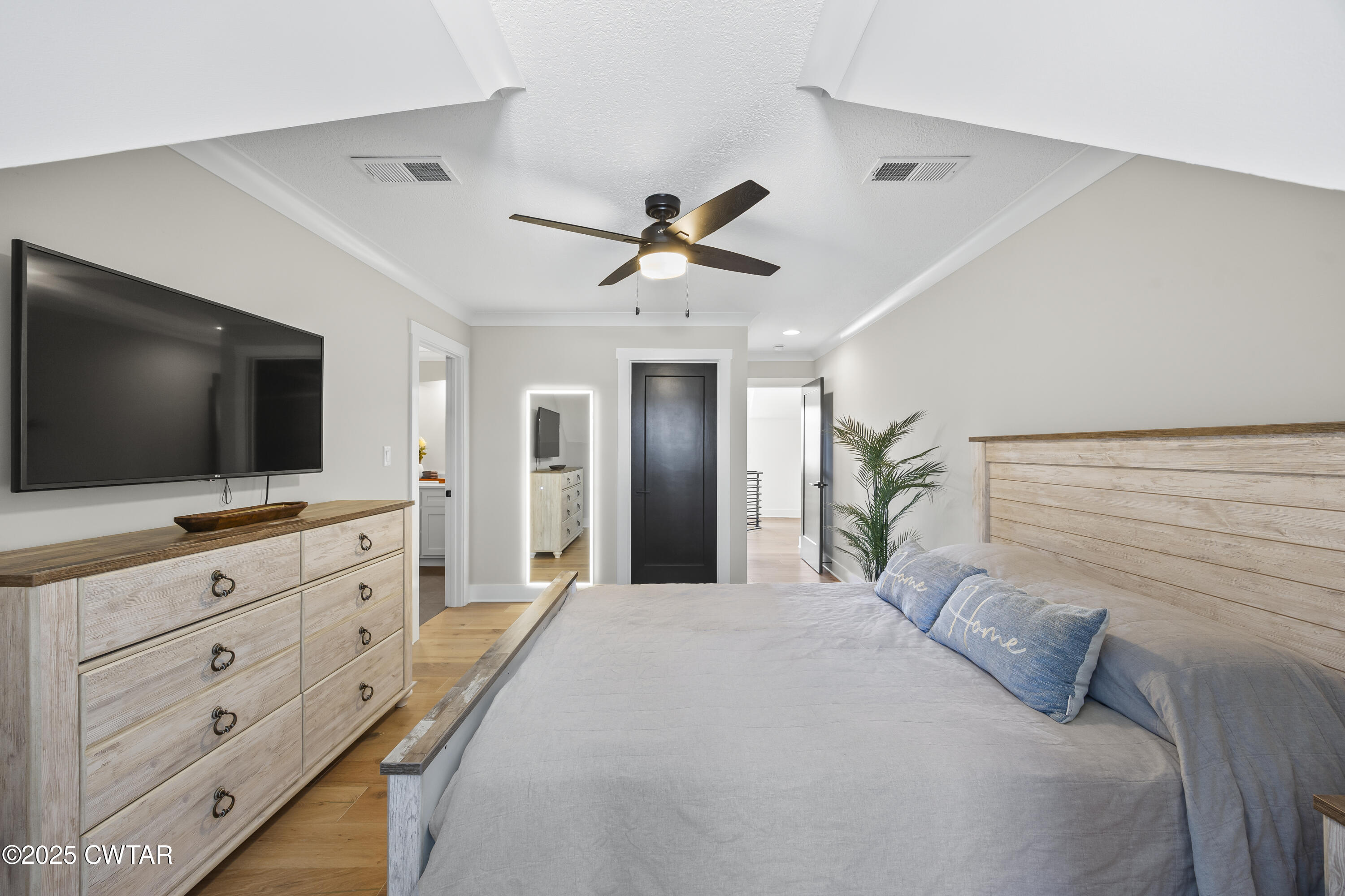 7 Swanbourne Cove Jackson, TN 38305 - Photo 26 of 44 a bedroom with a bed and a flat screen tv