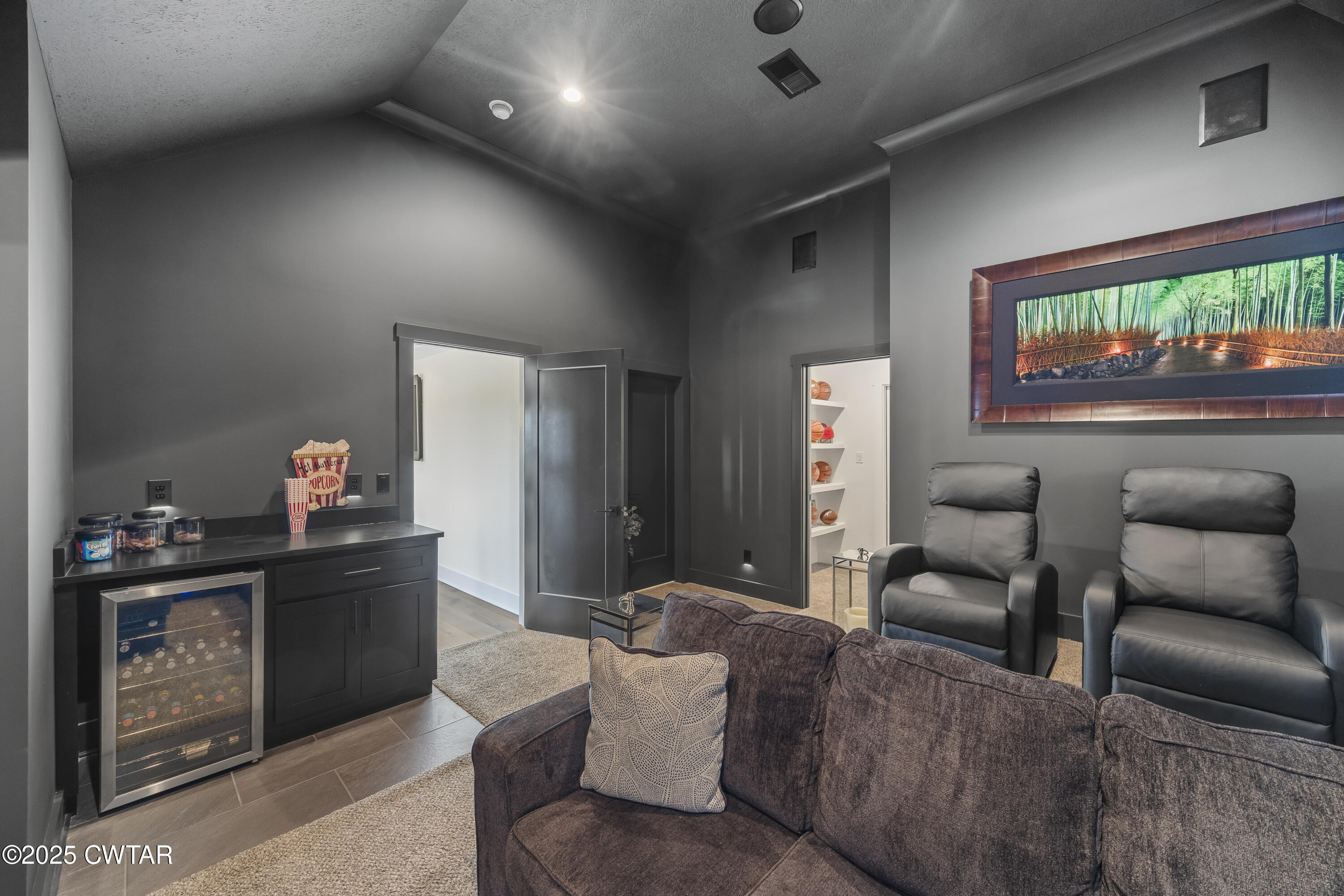 7 Swanbourne Cove Jackson, TN 38305 - Photo 28 of 44 a living room with furniture and a flat screen tv