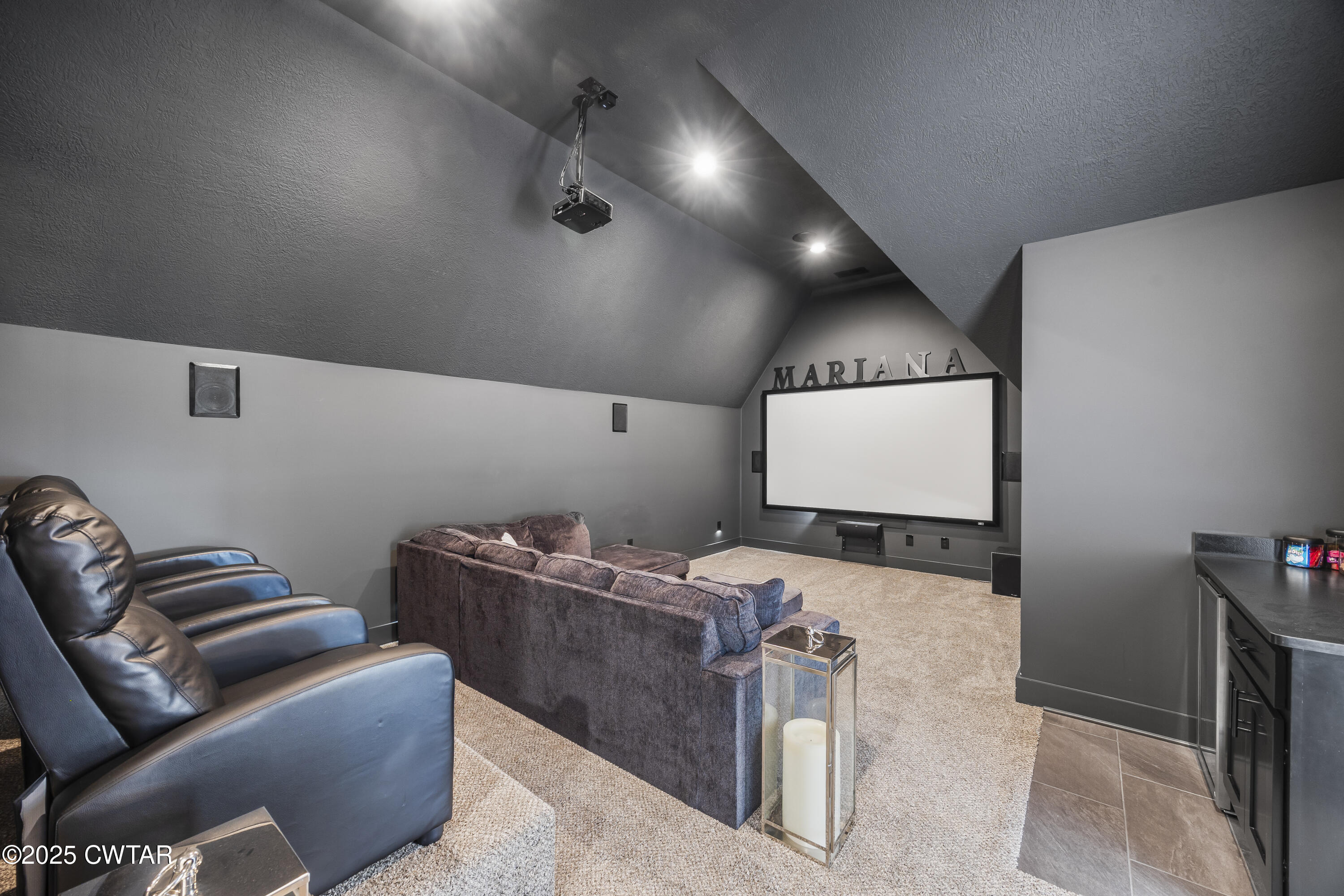 7 Swanbourne Cove Jackson, TN 38305 - Photo 29 of 44 a projector room with a couch