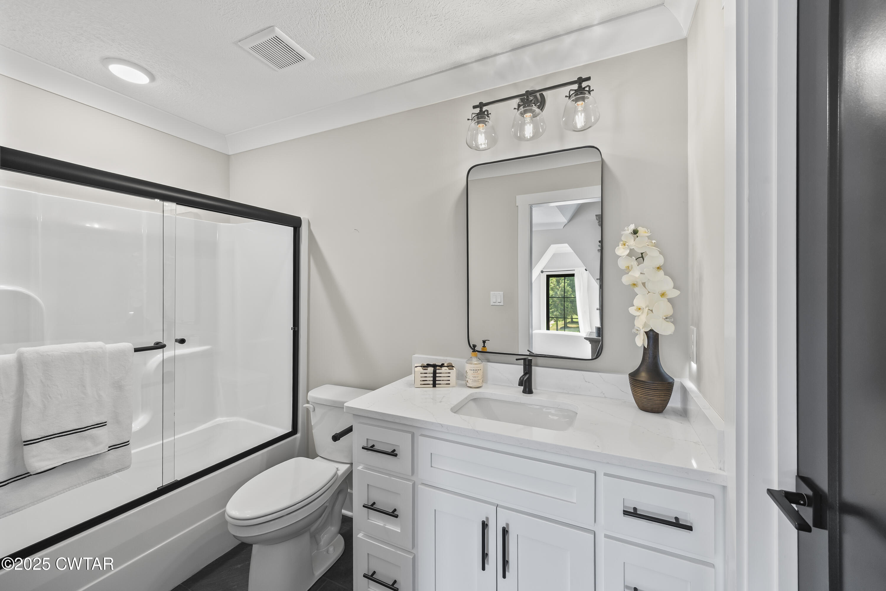 7 Swanbourne Cove Jackson, TN 38305 - Photo 32 of 44 a bathroom with a sink a toilet a mirror and shower