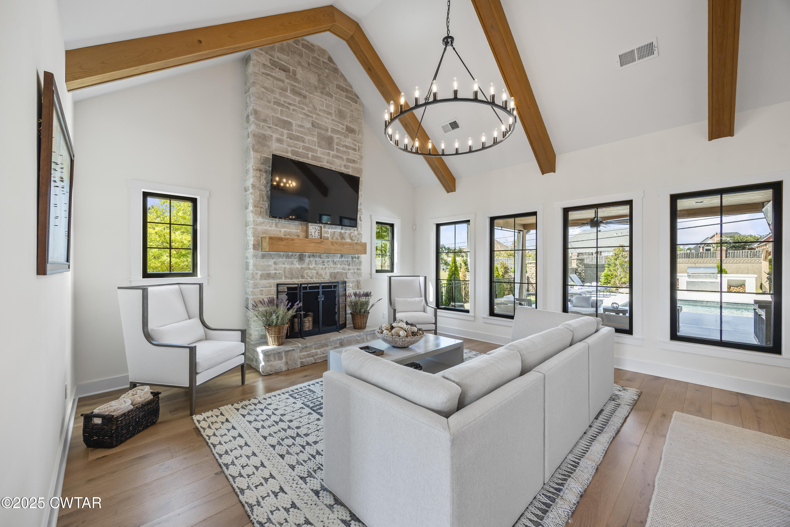 7 Swanbourne Cove Jackson, TN 38305 - Photo 4 of 44 a living room with furniture a fireplace and a table