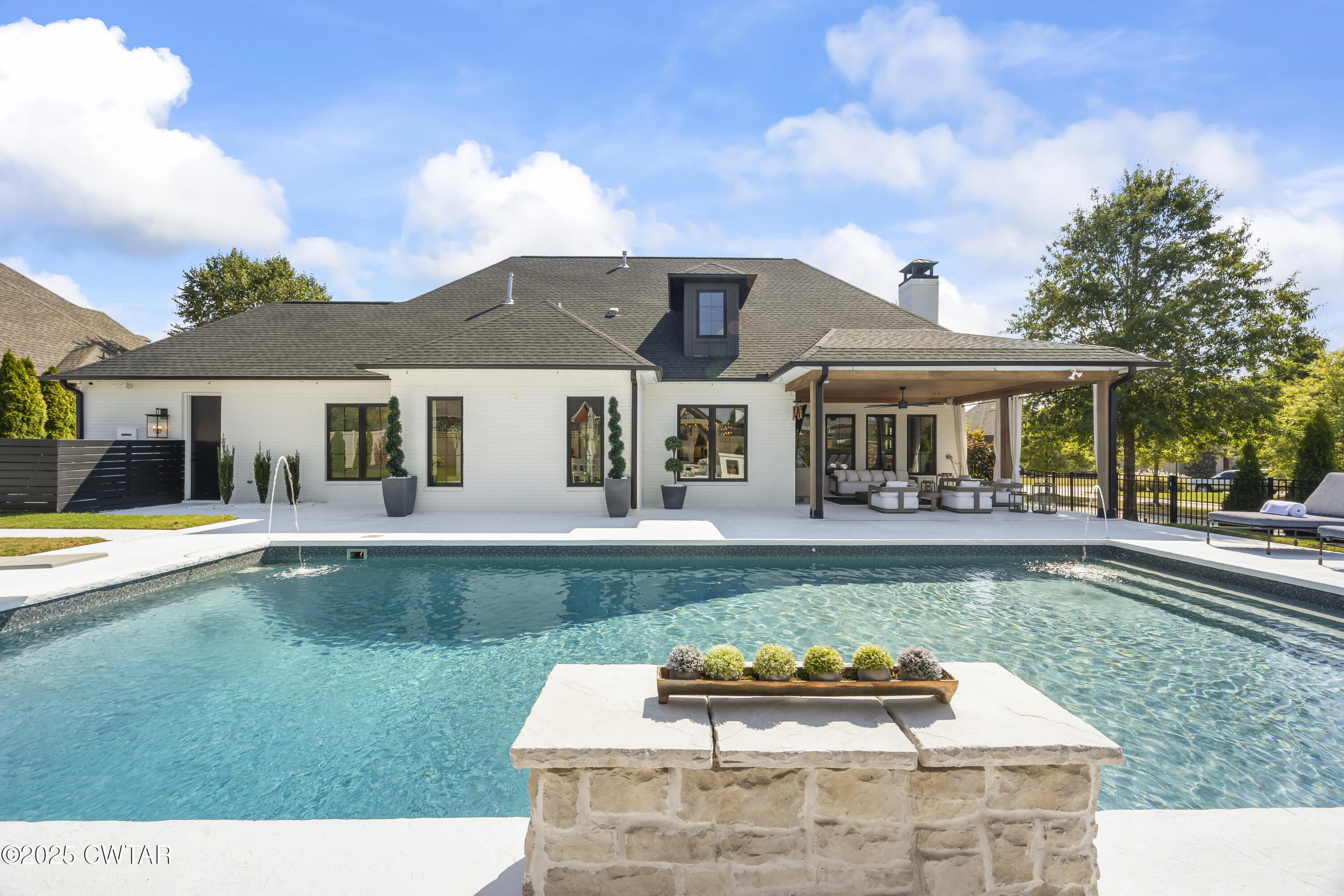 7 Swanbourne Cove Jackson, TN 38305 - Photo 41 of 44 a front view of a house with swimming pool having outdoor seating