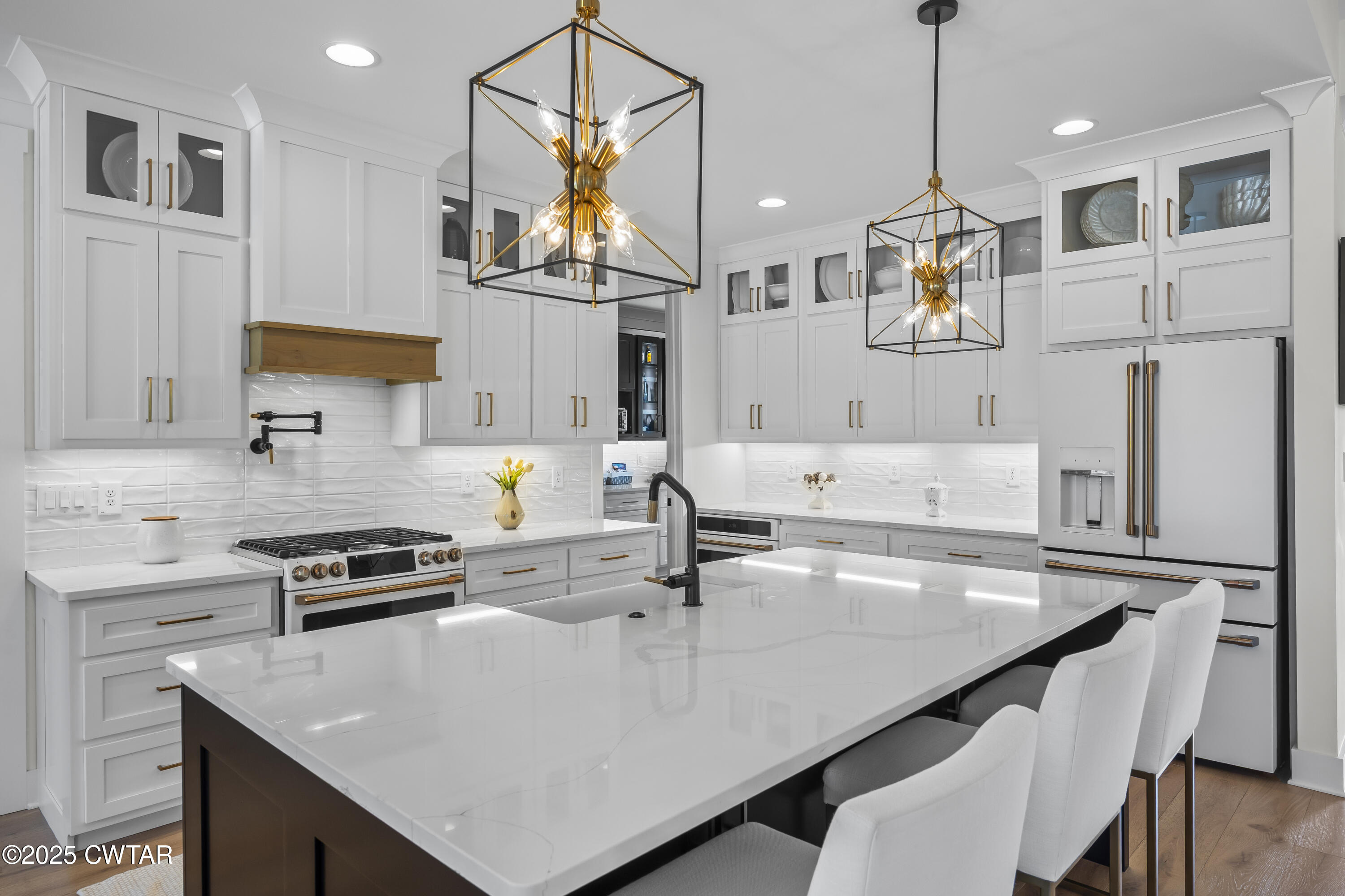 7 Swanbourne Cove Jackson, TN 38305 - Photo 8 of 44 a kitchen with stainless steel appliances granite countertop a sink a stove and refrigerator