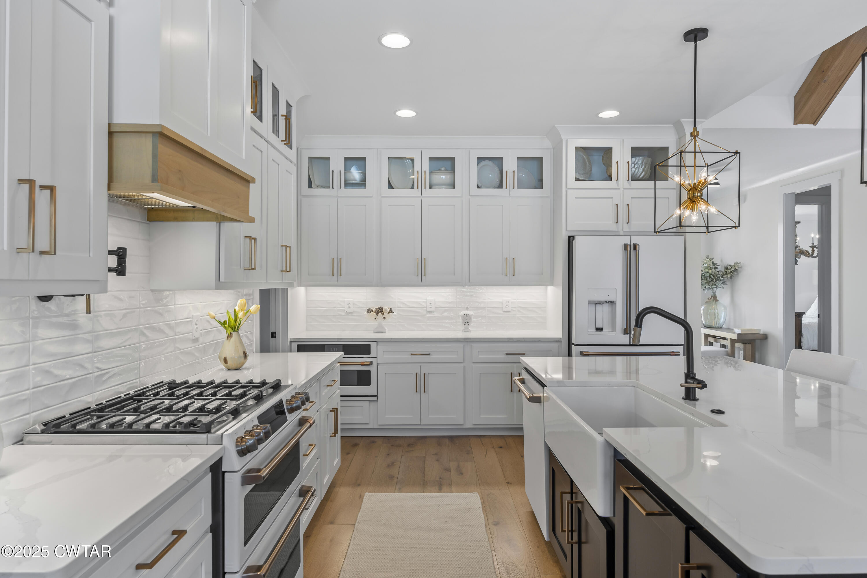 7 Swanbourne Cove Jackson, TN 38305 - Photo 9 of 44 a kitchen with a sink stove and cabinets
