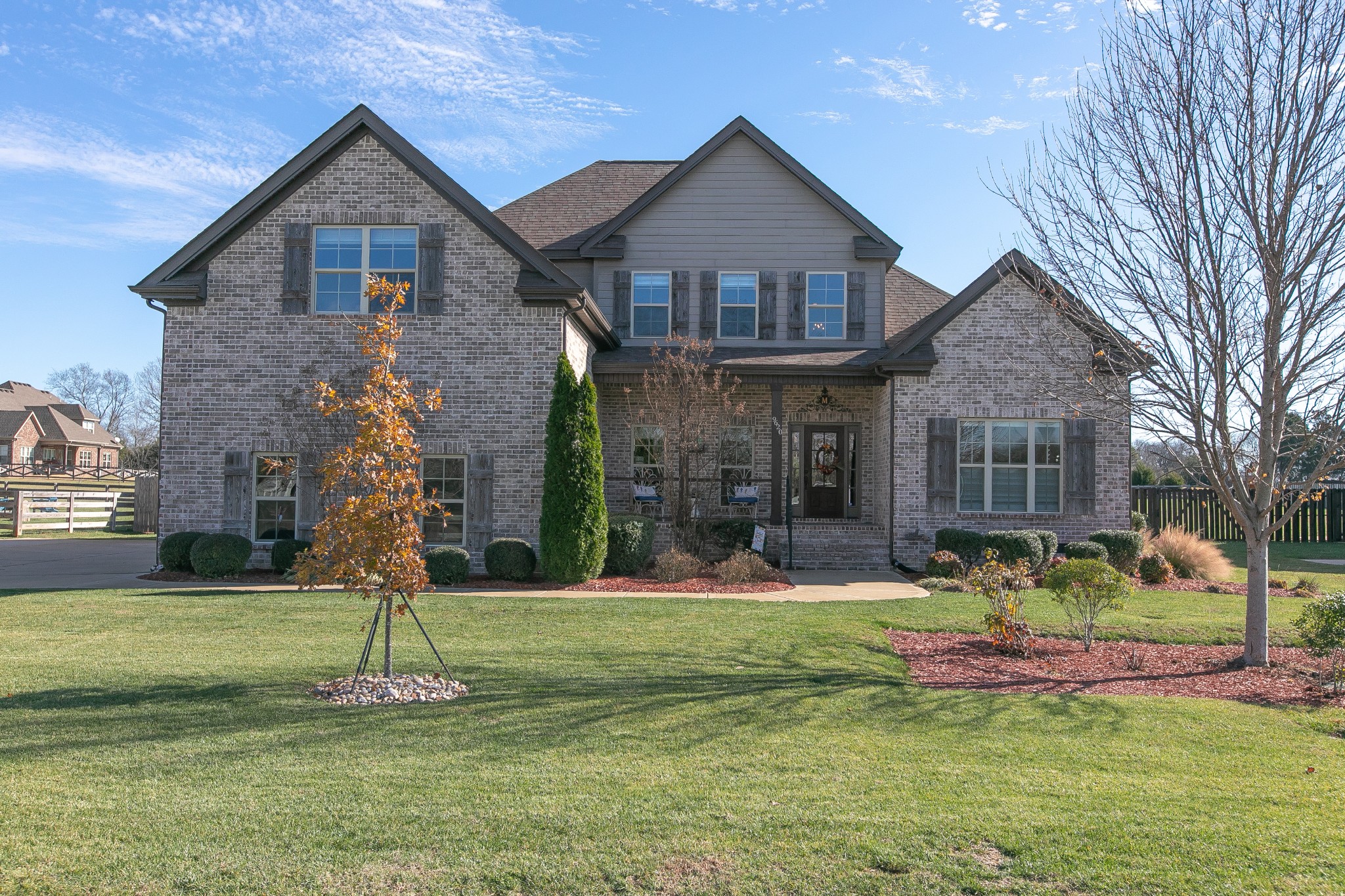 a front view of a house with a yard