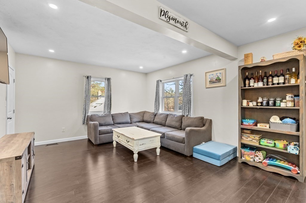 217 Roxy Cahoon Road Plymouth, MA 02360 - Photo 10 of 33 a living room with furniture and a window
