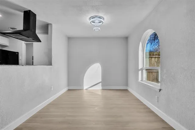a view of a livingroom with furniture and a window