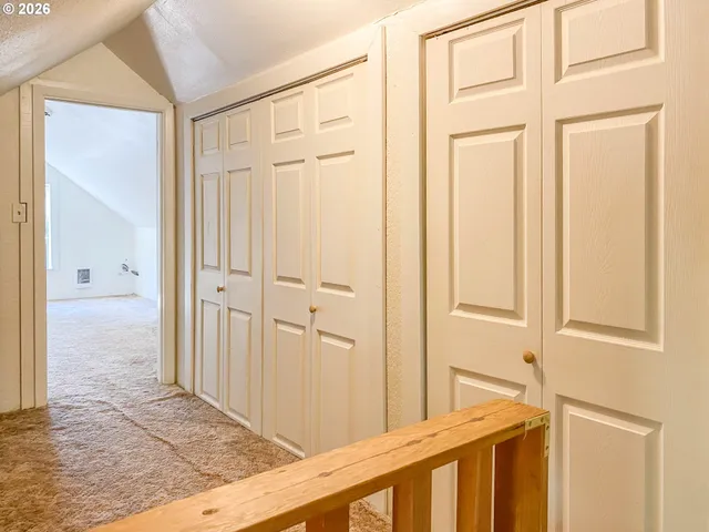 an empty room with a empty space and windows