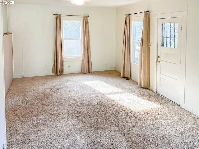 an empty room with windows