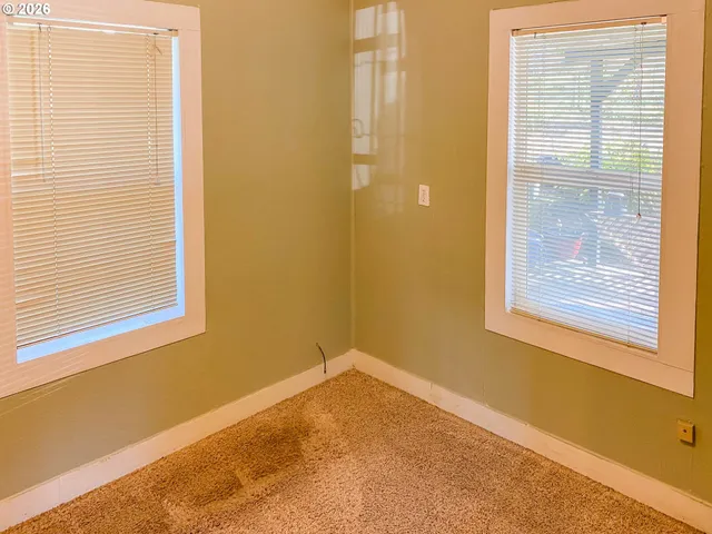 a view of a room that has a window