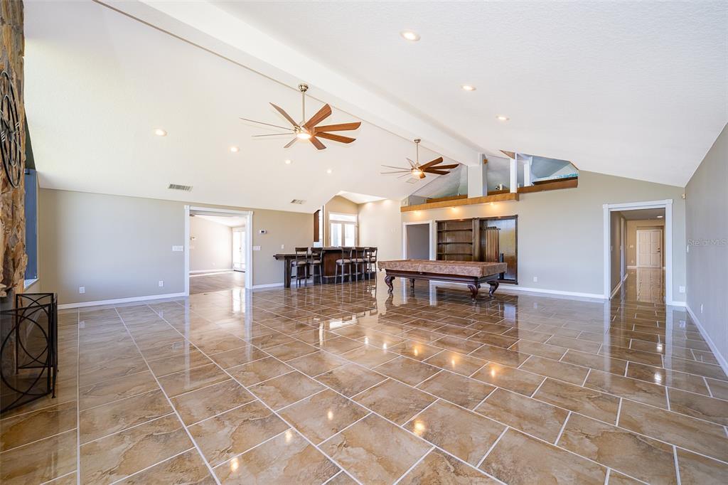 372 Rest Haven Road Geneva, FL 32732 - Photo 14 of 68 a living room with furniture a table and chairs next to a window