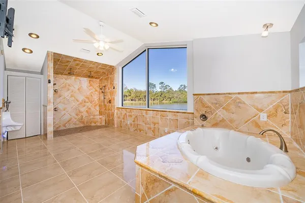a kitchen with a sink a counter top space cabinets and stainless steel appliances