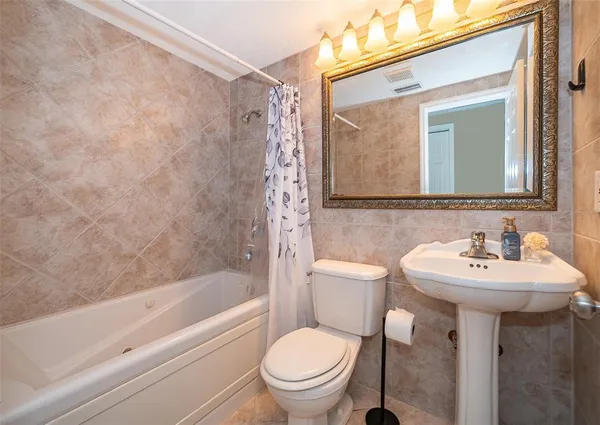 a view of a lake with houses in the background