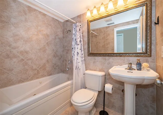 a view of a lake with houses in the background