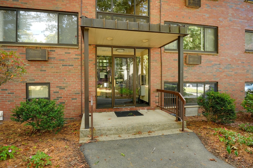 1323 Worcester Road, Unit 1E Framingham, MA 01701 - Photo 2 of 17 a house view with a outdoor space
